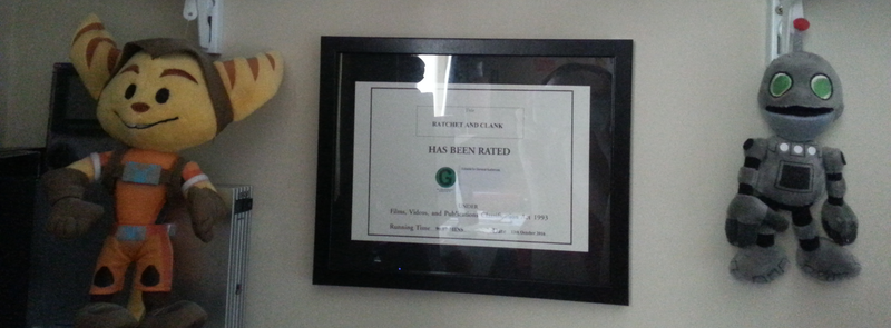 The Rating certificate as it appears on my wall. On the left is my corner for old consoles.